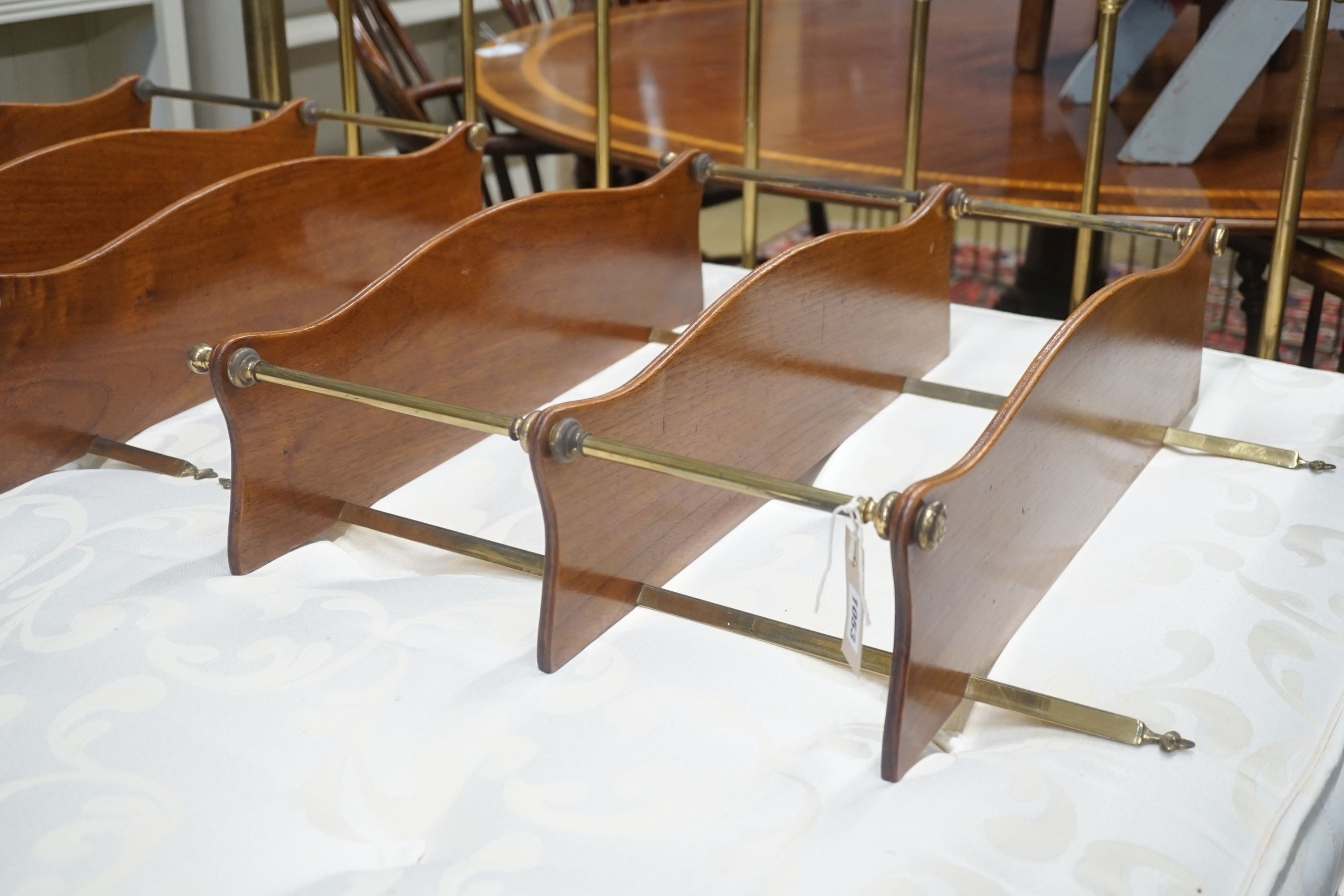 A pair of brass mounted serpentine mahogany three tier wall brackets, width 60cm depth 17cm height 70cm